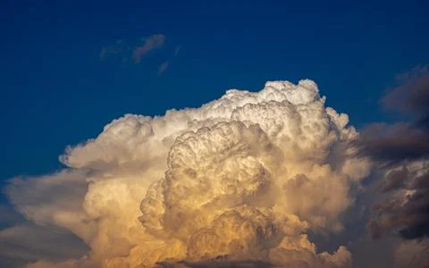 Cumulus clouds in a blue sky. Stock Photos