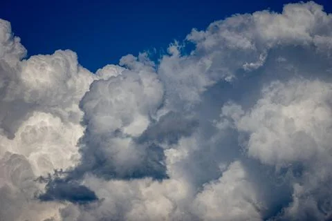 Cumulus clouds in a blue sky. Stock Photos
