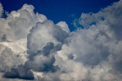 Cumulus clouds in a blue sky. Stock Photos