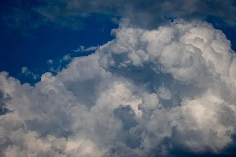 Cumulus clouds in a blue sky. Stock Photos