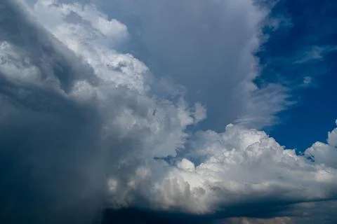 Cumulus clouds in a blue sky. Stock Photos