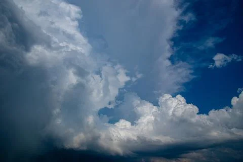 Cumulus clouds in a blue sky. Stock Photos