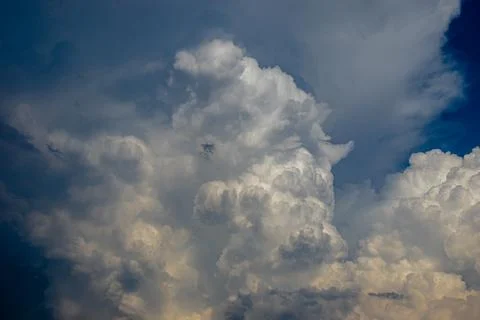 Cumulus clouds in a blue sky. Stock Photos