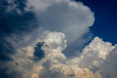 Cumulus clouds in a blue sky. Stock Photos