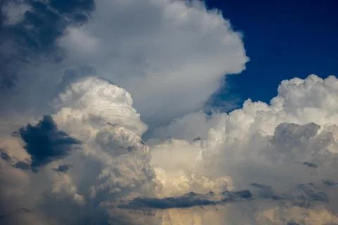 Cumulus clouds in a blue sky. Stock Photos