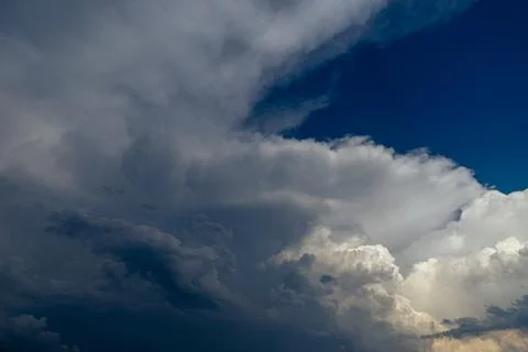 Cumulus clouds in a blue sky. Stock Photos