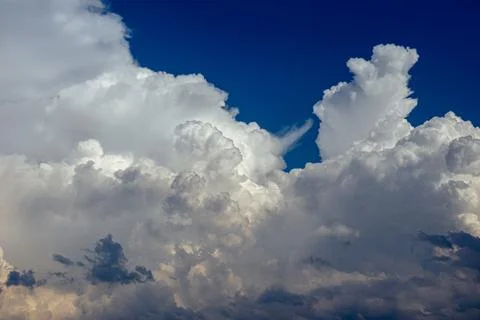 Cumulus clouds in a blue sky. Stock Photos