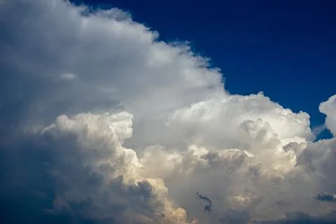 Cumulus clouds in a blue sky. Stock Photos