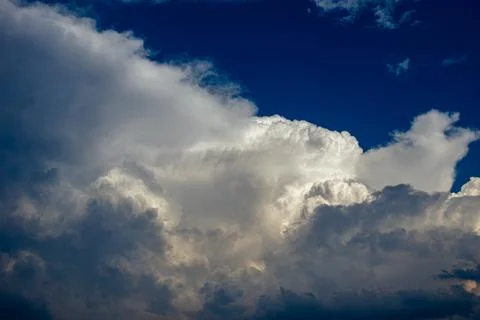 Cumulus clouds in a blue sky. Stock Photos