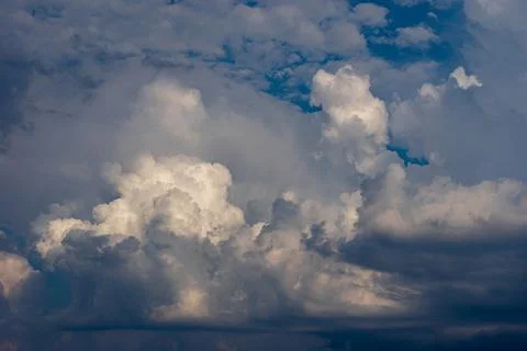 Cumulus clouds in a blue sky. Stock Photos