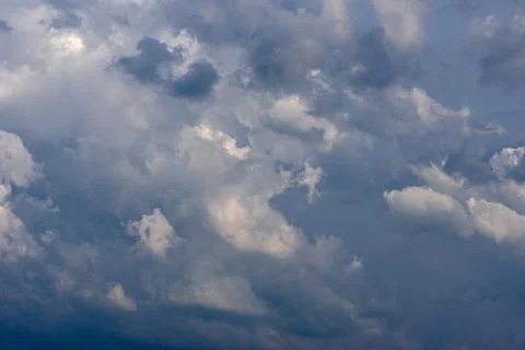 Cumulus clouds in a blue sky. Stock Photos