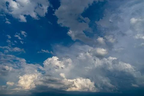 Cumulus clouds in a blue sky. Stock Photos