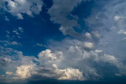 Cumulus clouds in a blue sky. Stock Photos
