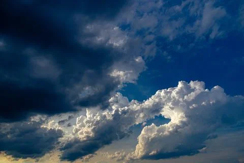 Cumulus clouds in a blue sky. Stock Photos