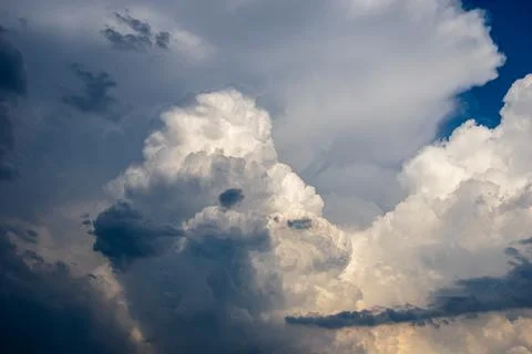Cumulus clouds in a blue sky. Stock Photos