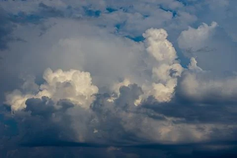 Cumulus clouds in a blue sky. Stock Photos