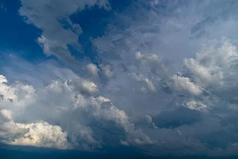 Cumulus clouds in a blue sky. Stock Photos