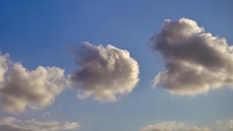 Cumulus clouds in the blue sky Stock Photos