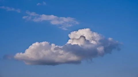 Cumulus clouds in the blue sky Stock Photos