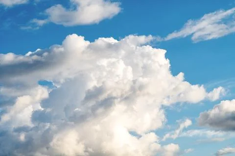 Cumulus clouds on the blue sky. Stock Photos