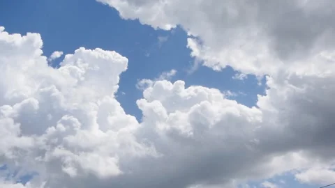 Cumulus clouds in the blue sky, slide shot Stock Footage 248531644