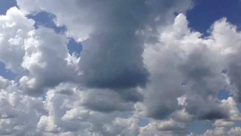 Cumulus clouds building in place to form rain shower Video stock 264769323