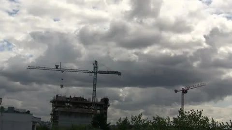 CUMULUS CLOUDS WITH BUILDING SITE CRANES TIMELAPSE Stock Footage 25593473