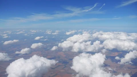 Cumulus clouds casting shadows over a varied landscape in 4k slow motion 60fp Stock Footage 284219191