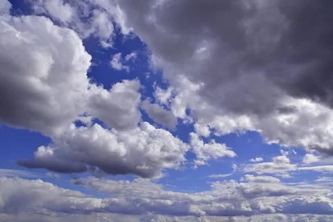 Cumulus clouds in the deep spring sky of the Western Urals Stock Photos