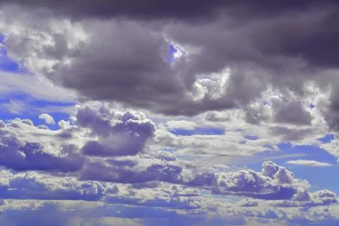 Cumulus clouds in the deep spring sky of the Western Urals Stock Photos