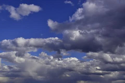 Cumulus clouds in the deep spring sky of the Western Urals Stock Photos