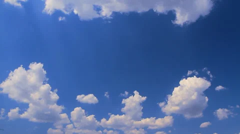 Cumulus clouds floating in a semi-circle Stock Footage 27333070