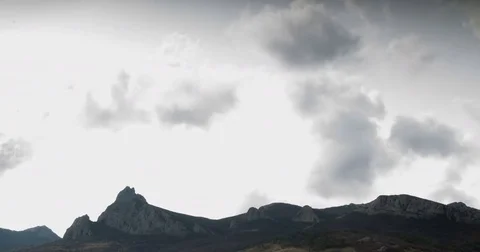 Cumulus clouds fly over the ridge Stock Footage 79387261