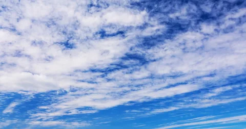 Cumulus clouds flying against a blue sky Stock Footage 117272071