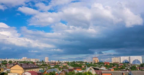Cumulus clouds flying against a cityscape Stock Footage 112613365