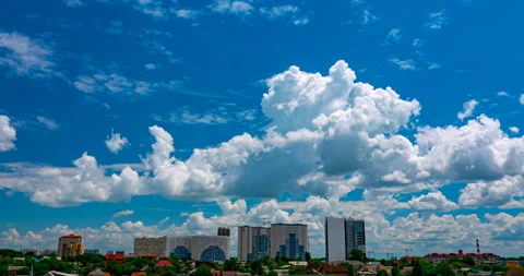 Cumulus clouds flying at the cityscape Stock Footage 155799471