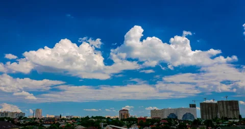 Cumulus clouds flying over cityscape Stock Footage 138447981