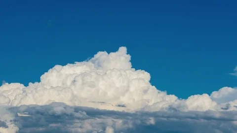 Cumulus clouds forming on a blue summer day Video stock 71312950