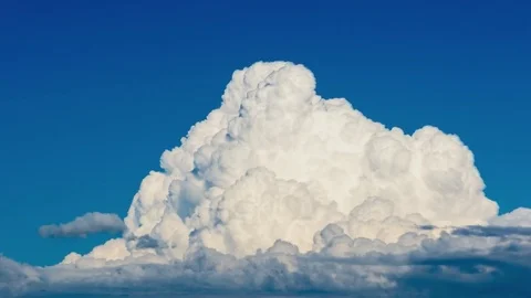 Cumulus clouds forming on a blue summer day Video stock 71313604