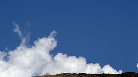 Cumulus Clouds grow over hillside HD Stock Footage 36626212
