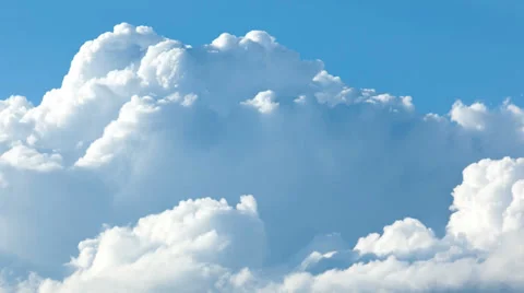 Cumulus clouds growing in the sky time lapse Stock Footage 34279323
