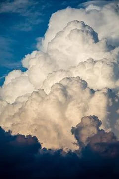 Cumulus clouds looking threatening in summer Stock Photos