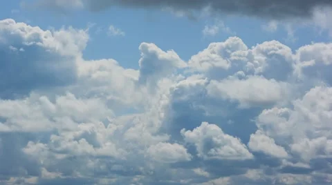 Cumulus clouds move against the blue sky. Stock Footage 62513881