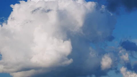 Cumulus clouds moves in the blue sky. Clouds running across brilliant blue sky Stock Footage 161650701