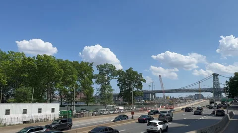 Cumulus Clouds over the FDR Drive in East Village in NYC Vídeos de archivo 343784730