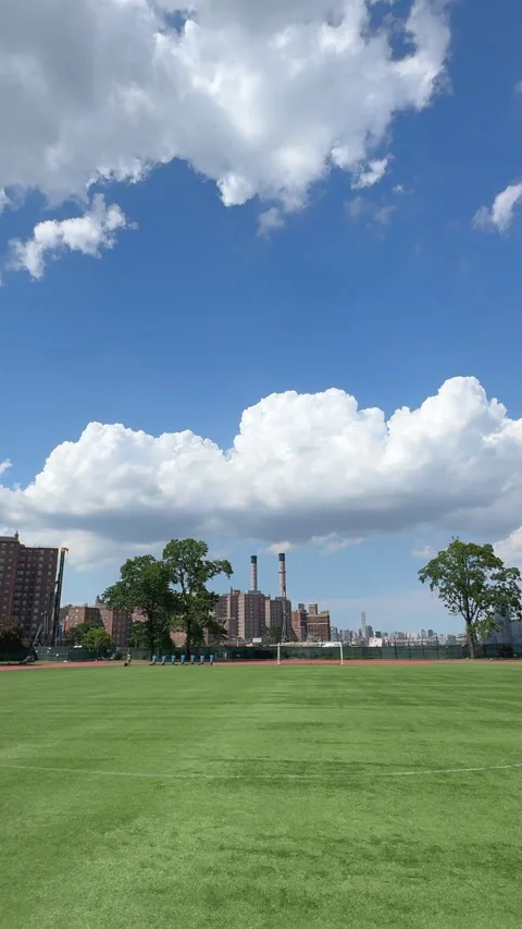 Cumulus Clouds over John V. Lindsay East River Park Track in East Village in NYC Видео 343786753