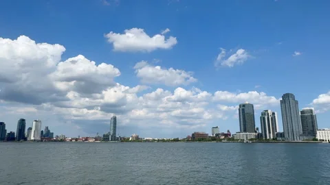 Cumulus Clouds over Long Island City Skyline from East River Park in NYC Stock-Footage 343792714