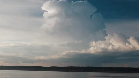 Cumulus clouds over the river during calm summer day Stock Footage 338322311