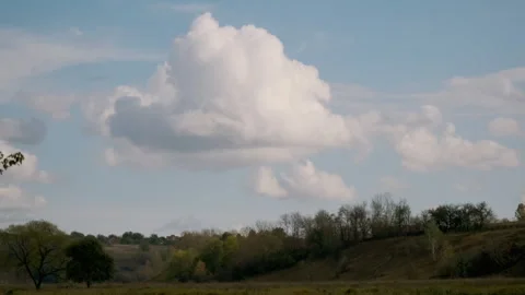 Cumulus clouds over a rural landscape Stock Footage 301453512