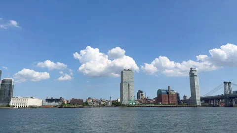 Cumulus Clouds over Williamsburg Skyline from East River Park in NYC Stock Footage 343791463